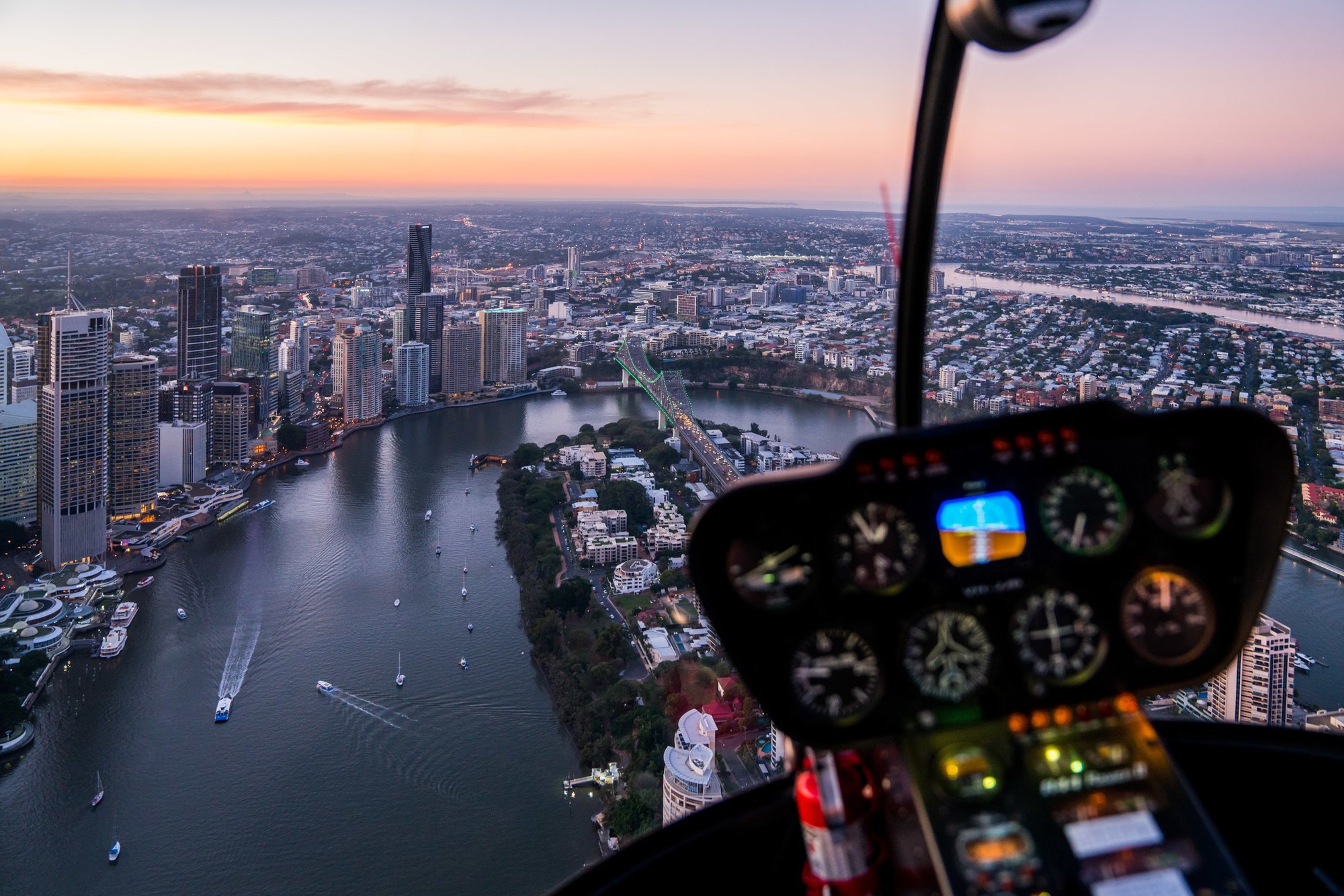 Aerial shot from a helicoptor highlighting the Brisbane River, Eagle Street Pier, Brisbane Story Bridge and Kanagaroo Point_Brisbane City